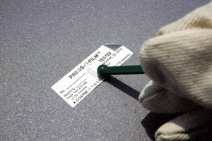 Photo 3 – Burnishing the tape to create a replica of the surface profile in the compressible foam.